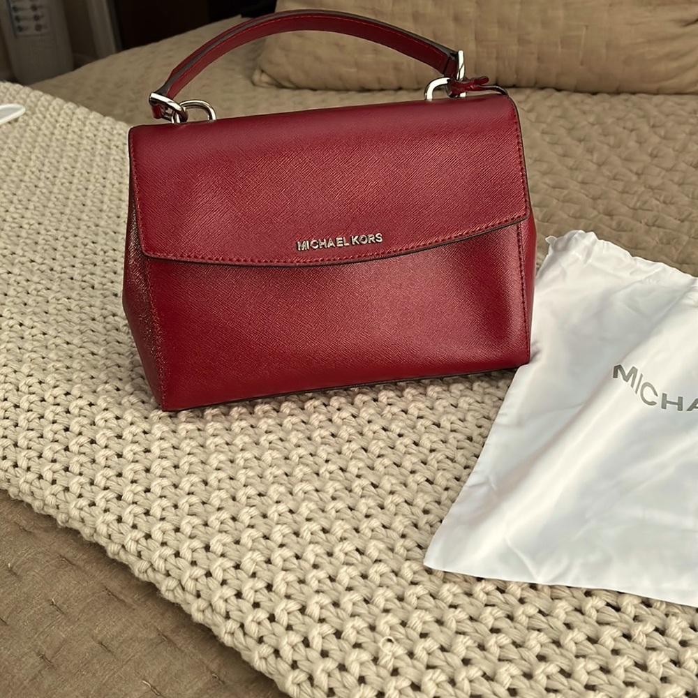 Beautiful classic red Michael Kors bag perfect for the fall.